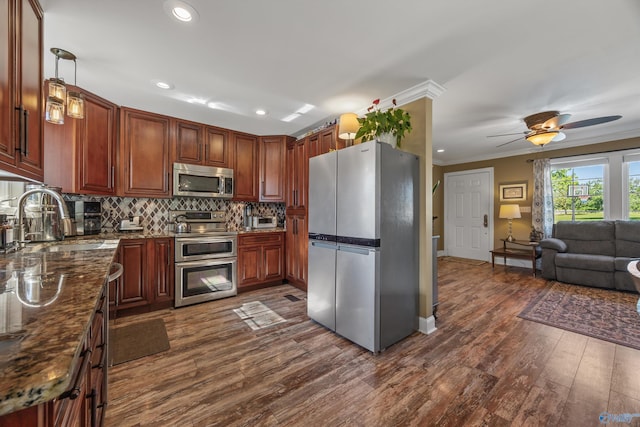 199 Ford Chapel Dr, Harvest, AL 35749 - kitchen with stainless steel appliances, a sink, dark wood finished floors, backsplash, and ornamental molding