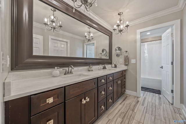 199 Ford Chapel Dr, Harvest, AL 35749 - full bathroom with a chandelier, crown molding, double vanity, and baseboards