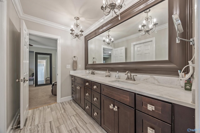 199 Ford Chapel Dr, Harvest, AL 35749 - bathroom featuring a chandelier, crown molding, double vanity, and baseboards