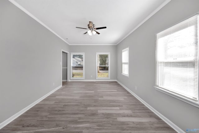 unfurnished room featuring crown molding, light hardwood / wood-style floors, and ceiling fan