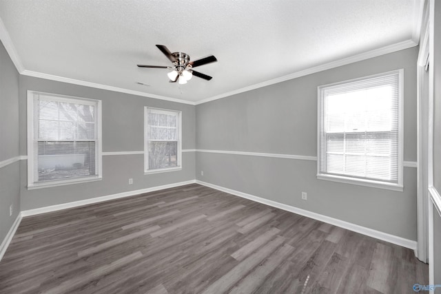 empty room featuring hardwood / wood-style floors, ornamental molding, a textured ceiling, and ceiling fan