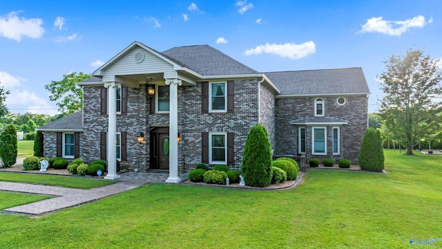 view of front of property with a front lawn