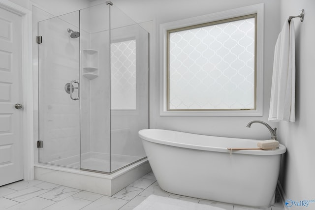 162 Saddle St, New Market, AL 35761 - bathroom featuring marble finish floor, a stall shower, and a soaking tub