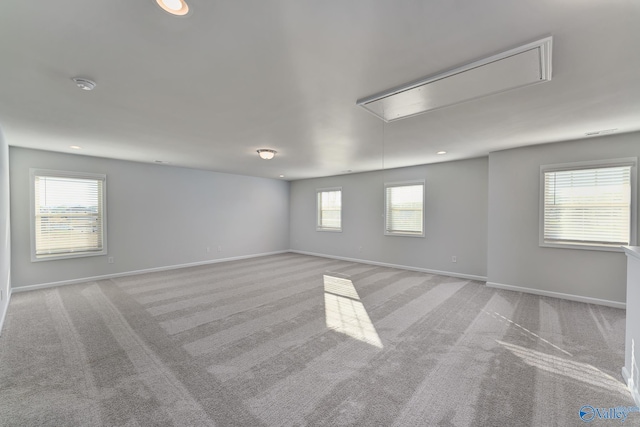 162 Saddle St, New Market, AL 35761 - unfurnished room with light carpet, baseboards, attic access, and recessed lighting