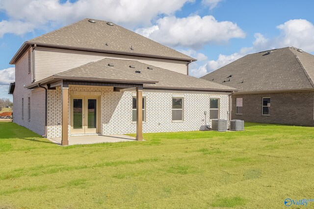 162 Saddle St, New Market, AL 35761 - rear view of house with brick siding, roof with shingles, a lawn, french doors, and a patio area