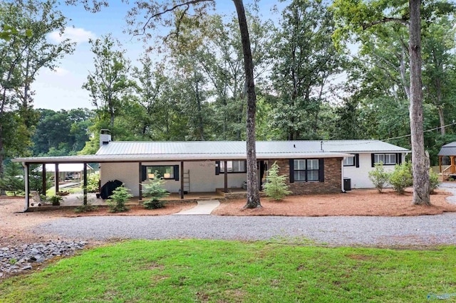 single story home featuring a carport