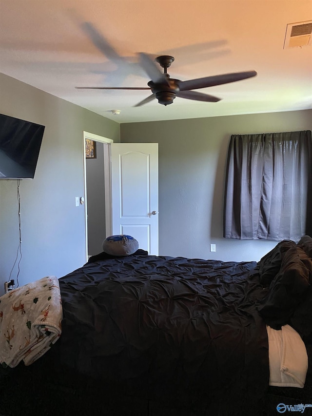 bedroom featuring a ceiling fan and visible vents