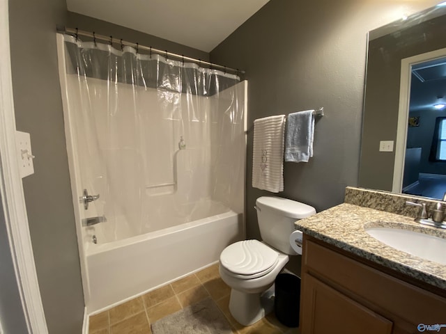 full bath with shower / tub combo, toilet, stone finish floor, and vanity