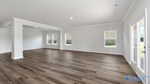 unfurnished living room featuring dark hardwood / wood-style flooring and ornamental molding