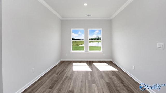 unfurnished room with dark hardwood / wood-style floors and crown molding