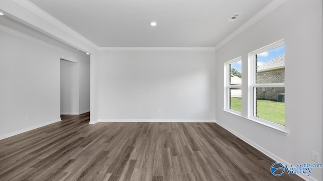 unfurnished room with crown molding and dark hardwood / wood-style floors