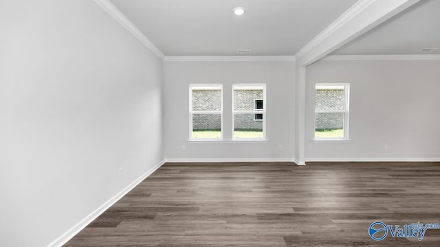 empty room with ornamental molding, dark hardwood / wood-style flooring, and a healthy amount of sunlight