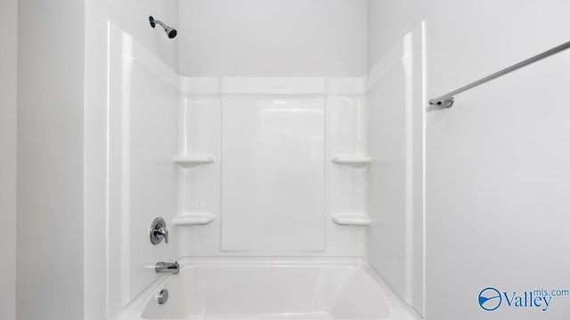 bathroom with shower / bathing tub combination