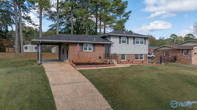 split level home featuring a front yard, a storage unit, and a carport