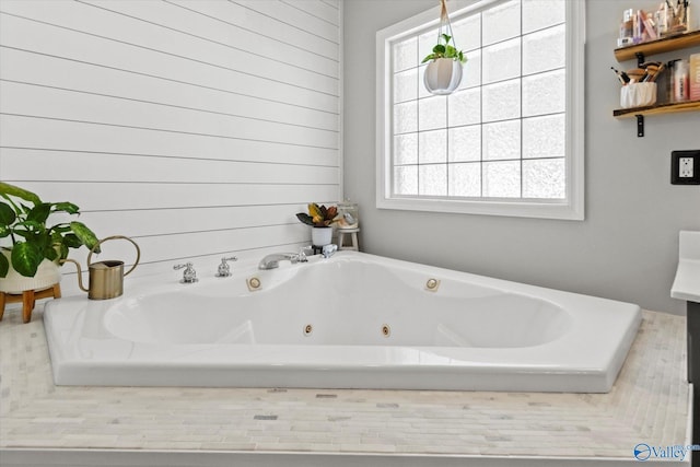 bathroom with tiled bath