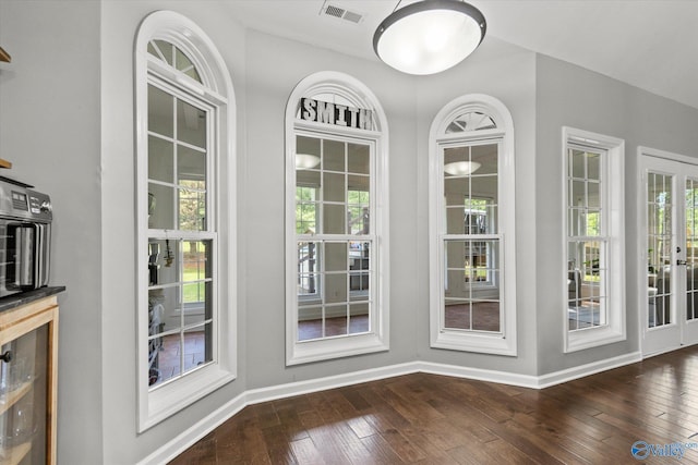 doorway featuring dark wood-type flooring