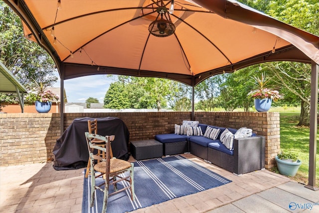 view of patio / terrace with a gazebo, area for grilling, and an outdoor living space