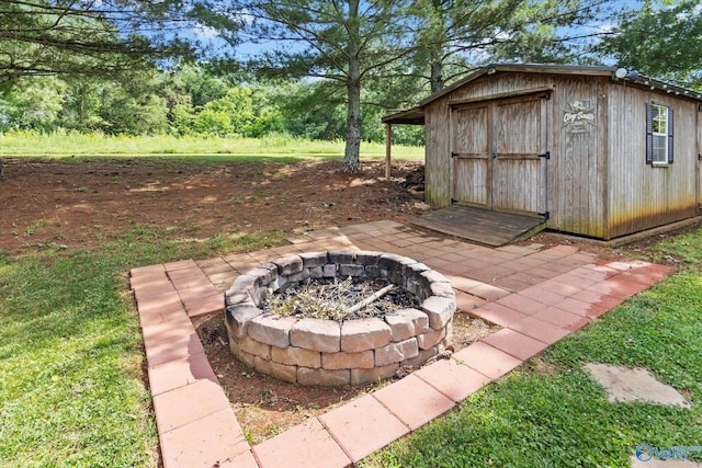 view of outbuilding featuring an outdoor fire pit