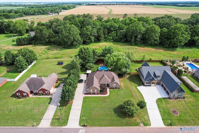 birds eye view of property with a rural view