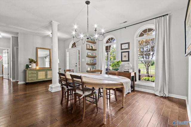 dining space with decorative columns, a healthy amount of sunlight, and dark hardwood / wood-style floors