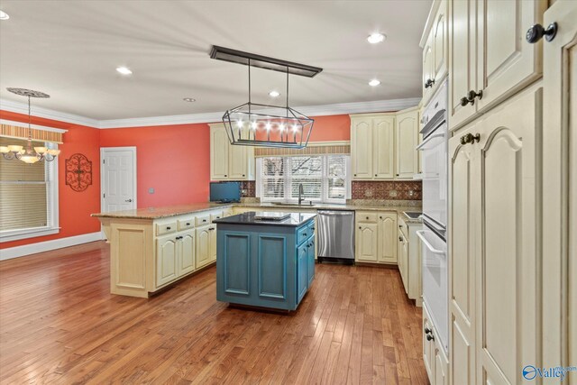 kitchen with crown molding, decorative backsplash, a sink, wood finished floors, and dishwasher