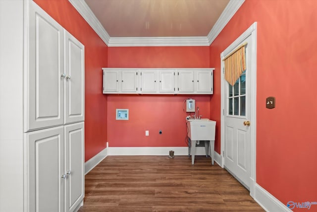 washroom with washer hookup, dark wood-style flooring, cabinet space, and crown molding