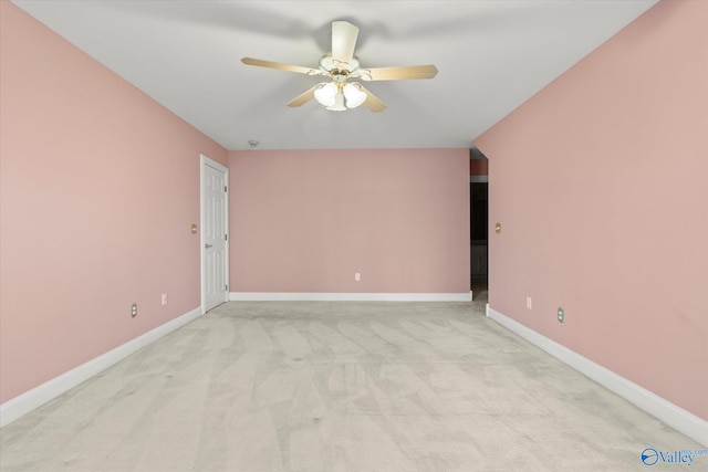 empty room with light carpet, ceiling fan, and baseboards