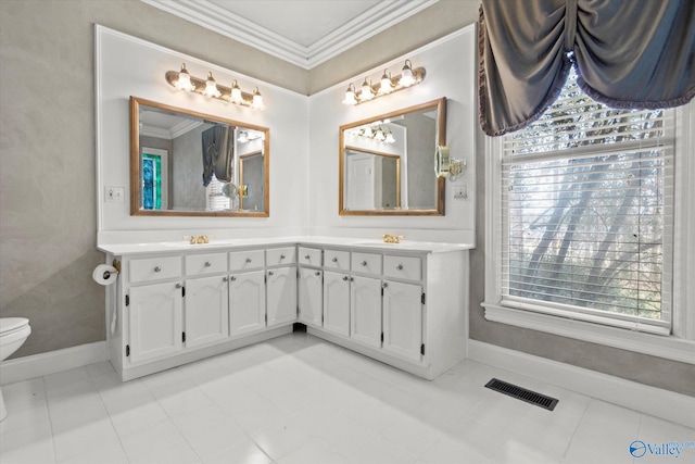 full bath featuring plenty of natural light, visible vents, crown molding, and a sink