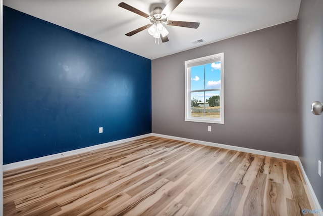 unfurnished room featuring ceiling fan and light hardwood / wood-style floors