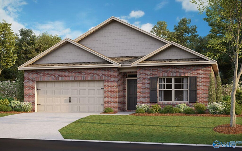 view of front of home featuring brick siding, driveway, a garage, and a front lawn