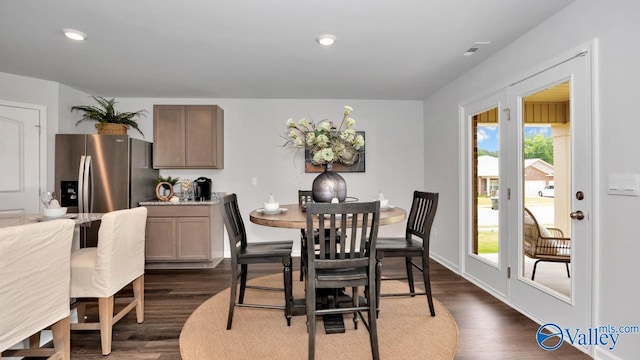 dining room with dark hardwood / wood-style flooring