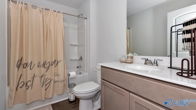 full bathroom featuring vanity, shower / tub combo, and toilet