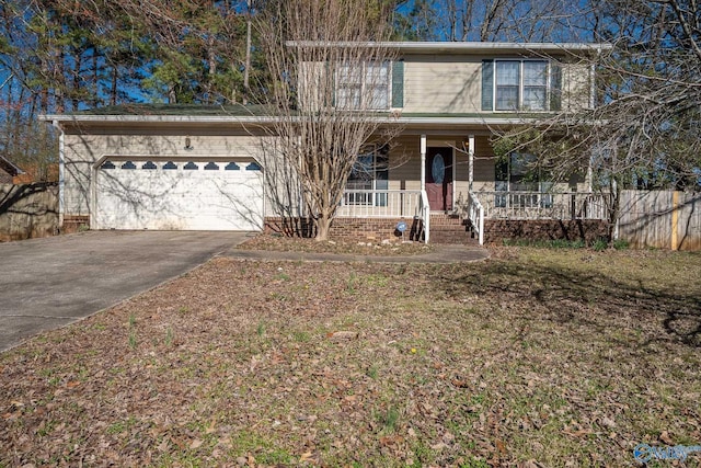 traditional-style home featuring a garage, a porch, and driveway