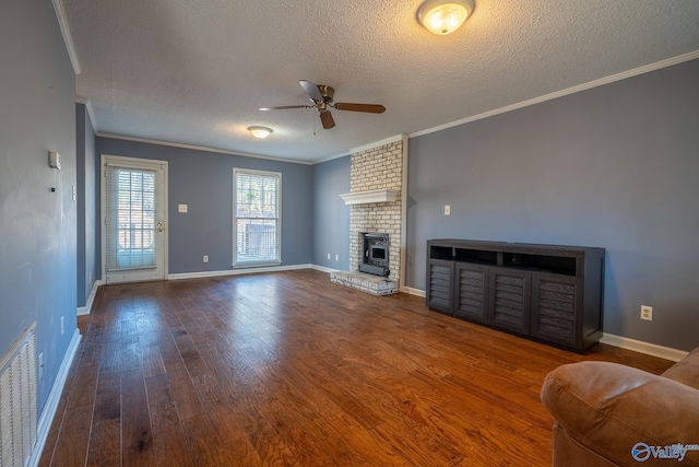 living area with hardwood / wood-style floors, a fireplace, and ornamental molding