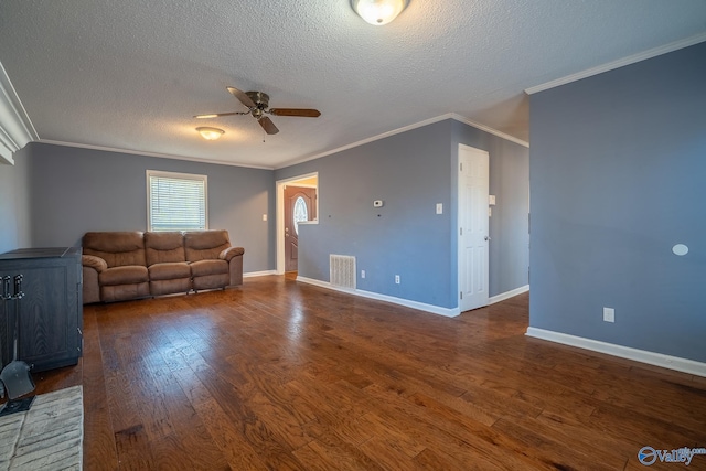 living area with visible vents, a ceiling fan, a textured ceiling, dark wood-style floors, and baseboards