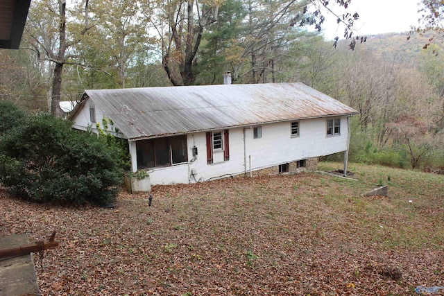 view of front of home with a sunroom