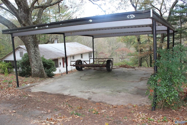 view of parking / parking lot featuring a carport