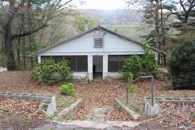 view of front facade with a sunroom