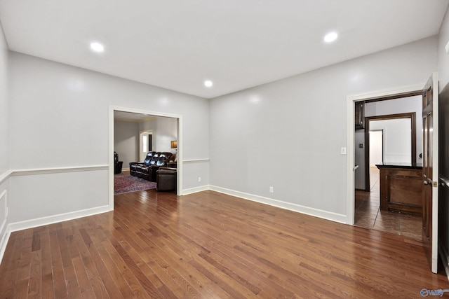 empty room featuring dark hardwood / wood-style flooring