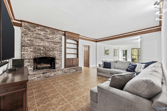 living room featuring ornamental molding and a textured ceiling