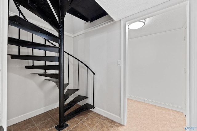 staircase featuring tile patterned flooring