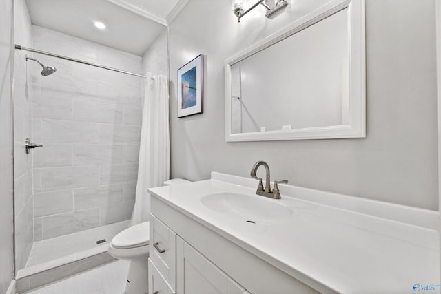 bathroom with vanity, crown molding, a shower with shower curtain, and toilet