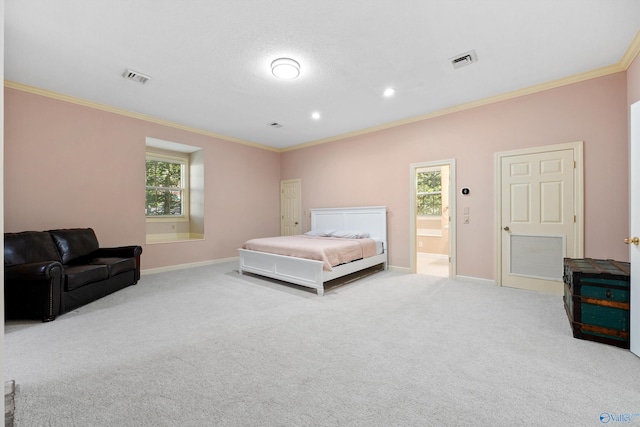 bedroom featuring ornamental molding, light carpet, multiple windows, and ensuite bath