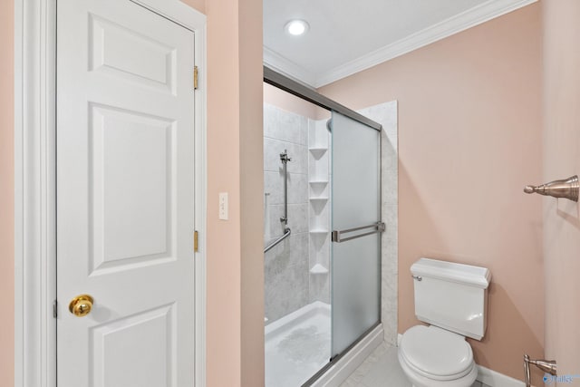 bathroom with a shower with door, ornamental molding, toilet, and tile patterned flooring