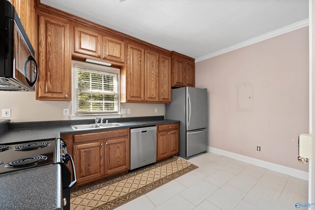 kitchen with stainless steel appliances, ornamental molding, and sink