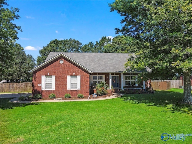 23265 Frank St, Athens, AL 35613 - ranch-style house with brick siding, fence, and a front lawn