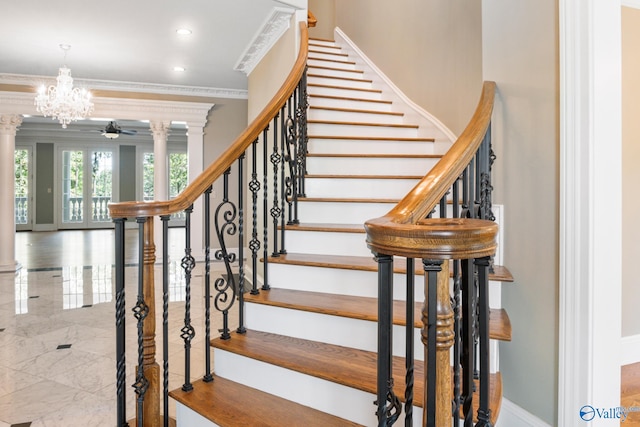 stairway featuring tile patterned flooring, crown molding, ornate columns, and an inviting chandelier