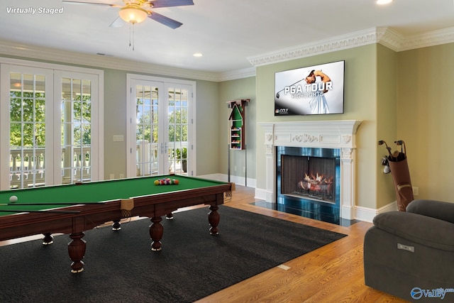 recreation room featuring hardwood / wood-style flooring, crown molding, pool table, and french doors