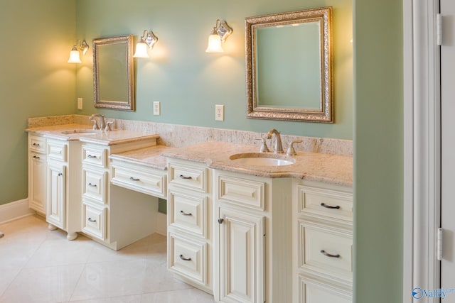 bathroom featuring tile patterned flooring and vanity