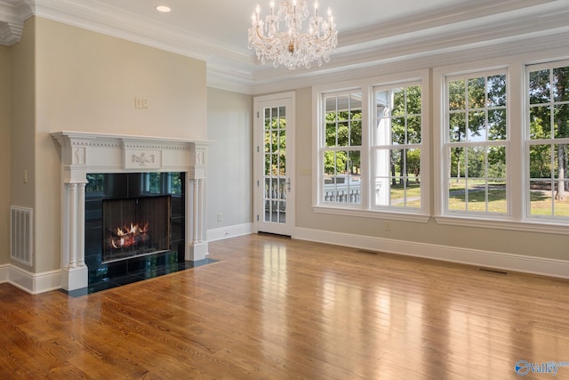 unfurnished living room with plenty of natural light and light hardwood / wood-style floors